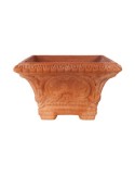 Vaso quadrato decorato con piedini di rialzo in terracotta