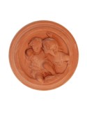Pannello tondo con putti in terracotta